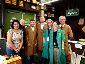 Group photo of coffin works staff and volunteers in the reception area