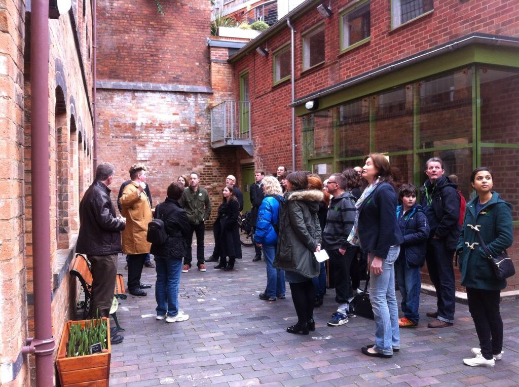 Visitors on a tour in the courtyard