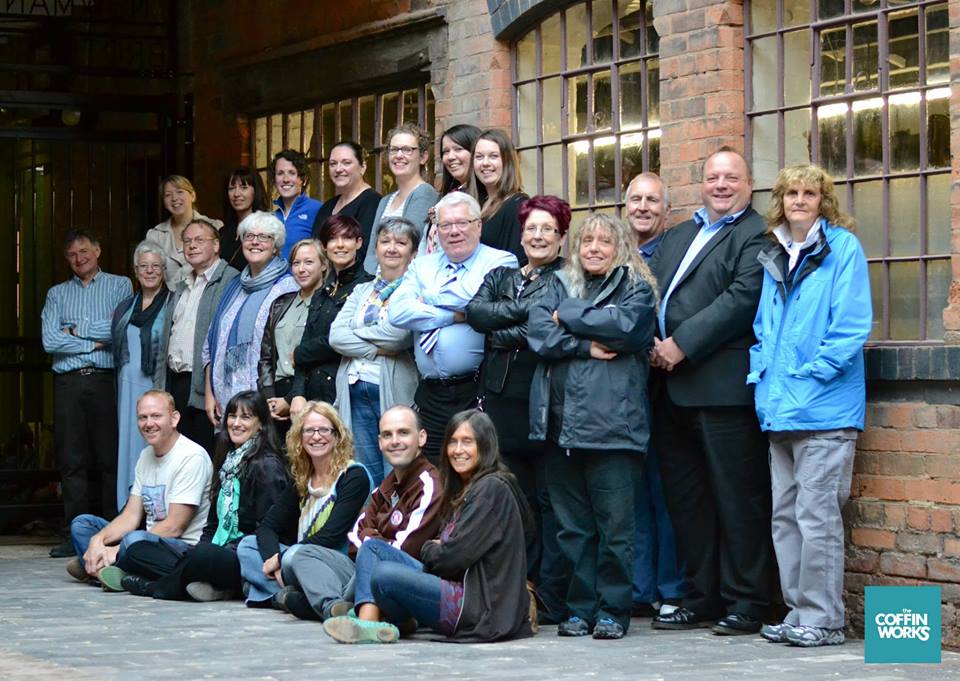 Group image of volunteers gathered in the courtyard