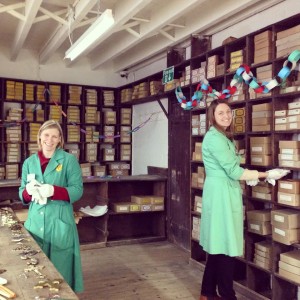 Vicki, and another volunteer in the stock room doing conservation cleaning
