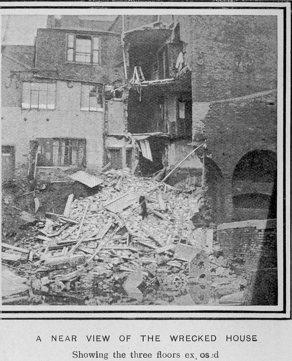 Newspaper image of the burst canal. A near view of a wrecked house