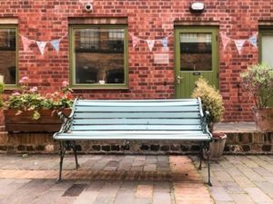 Green bench in the courtyard