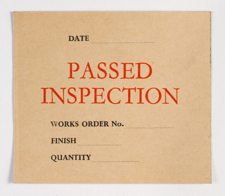Paper tag – Passed Inspection in red