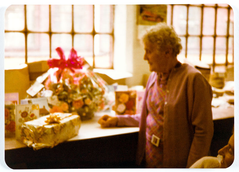 Dolly Dunsby admiring her gifts from the party