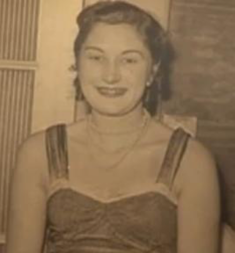 black and white image of a young joyce green in a party dress