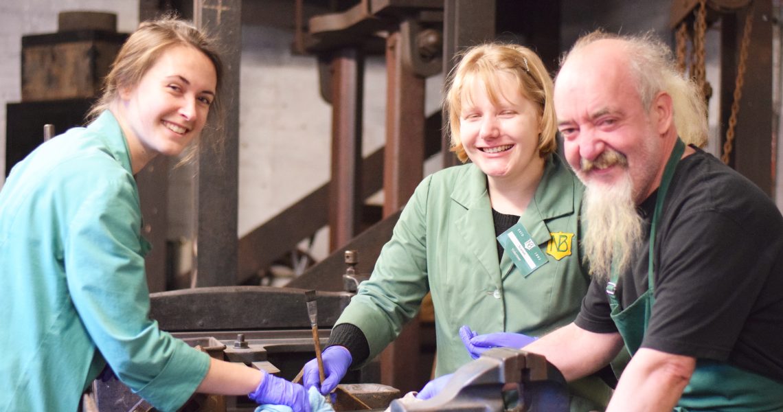 Francis, Nina and Scarlett conserving dies in stamp room